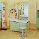 a 1960s doctor's office with yellow walls and green cabinets