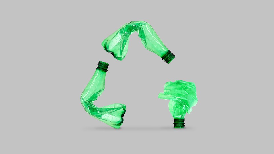 Plastic bottles form a recycling symbol.