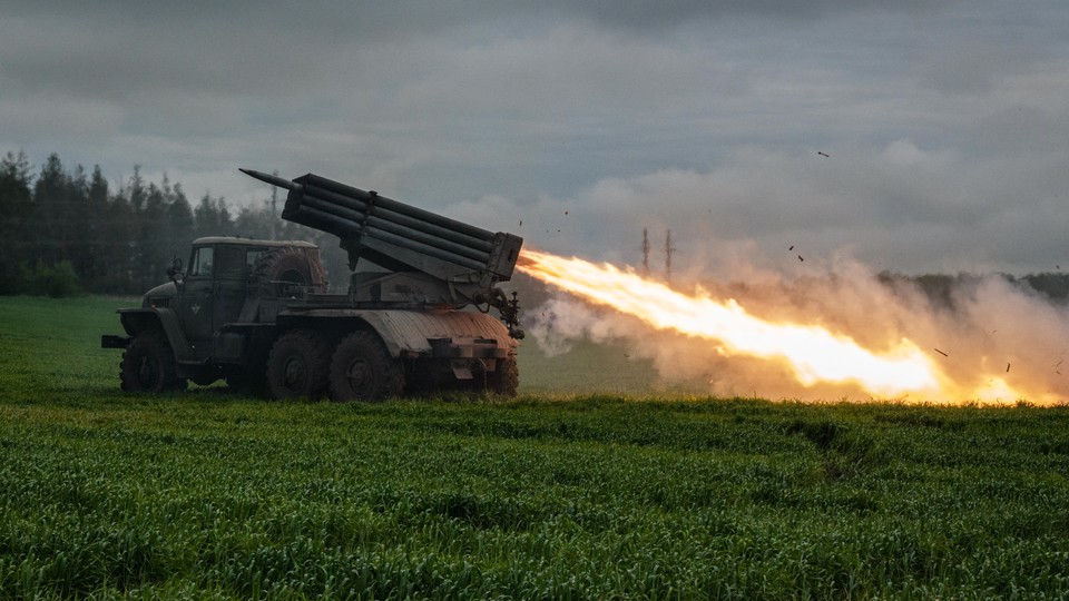 A rocket is launched from a truck-mounted multiple-rocket launcher.