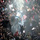 Iranians set a U.S. and an Israeli flag on fire during a funeral procession organized to mourn the slain military commander Qassem Soleimani.