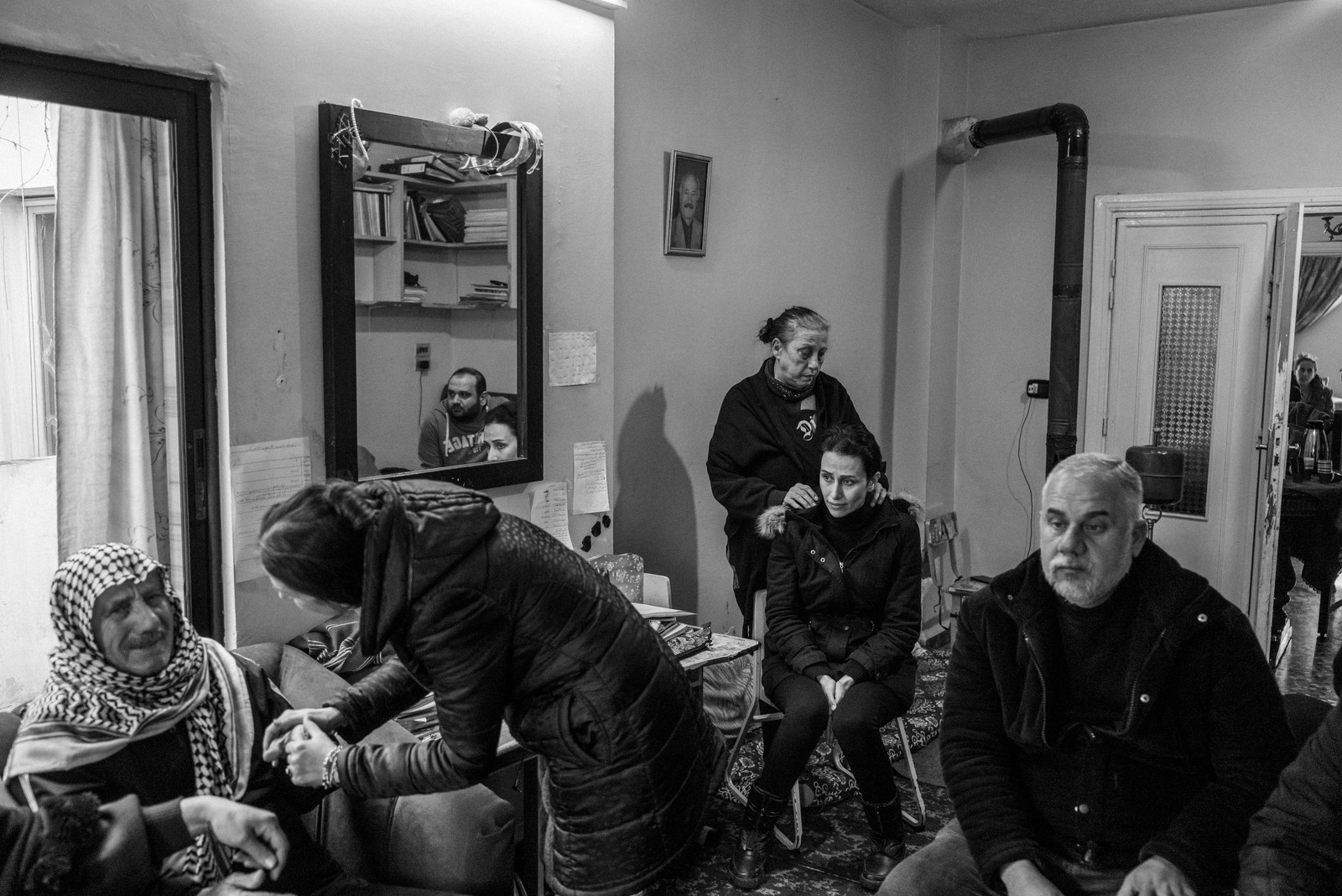 Picture of family members of Abdullah Naem mourning his death days after his body was found in a field outside an Alawite neighborhood in Homs. January 13, 2025.