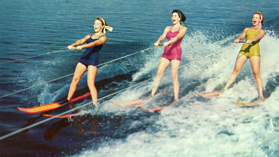 Photo of three women waterskiing in the 1950s