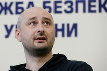 Arkady Babchenko speaking at a news conference