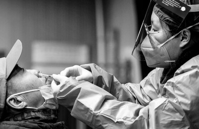 Photo of someone receiving a nasal spray vaccine in Beijing, China