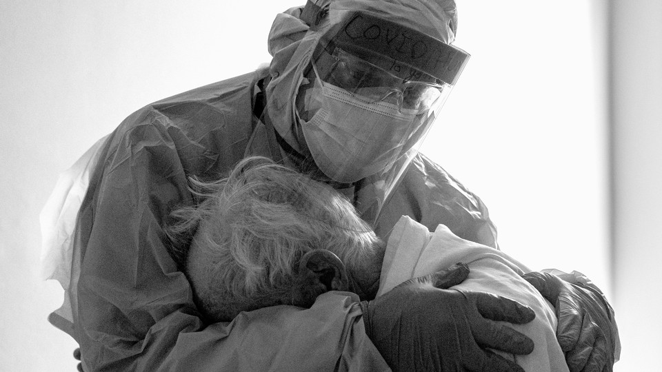 A doctor holding a patient