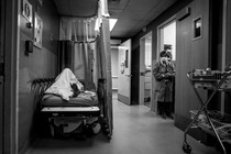 A patient rests in a corridor, waiting for a room at Providence Cedars-Sinai Tarzana Medical Center in California on January 3, 2021.