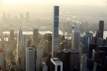 432 Park Avenue, an apartment building in Manhattan, towers over its neighbors. Most of its units are priced in the tens of millions of dollars. 