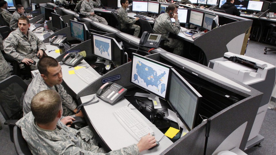 Personnel work at the Air Force Space Command Network Operations & Security Center at Peterson Air Force Base in Colorado Springs.