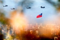 Military helicopters carrying Taiwan flags conduct a flyby rehearsal ahead of National Day celebration, near Taipei 101 , amid escalating tensions between Taipei and Beijing, China, in Taipei, Taiwan, on October 5, 2021.