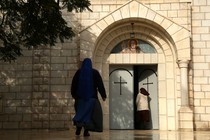 Christian worshippers arrive to attend Christmas Day Mass at the Roman Catholic Church of Holy Family in Gaza City on December 25, 2017.