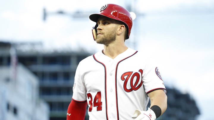 A Washington Nationals fan wears a Bryce Harper jersey in the stands before  a baseball game between the Washington Nationals and the Atlanta Braves,  Friday, July 7, 2017, in Washington. Harper, Mike