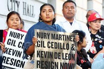 protestors holding signs demanding Nury Martinez, Gil Cedillo, and Kevin de León resign