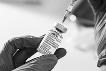 A picture of a vial of a COVID-19 vaccine