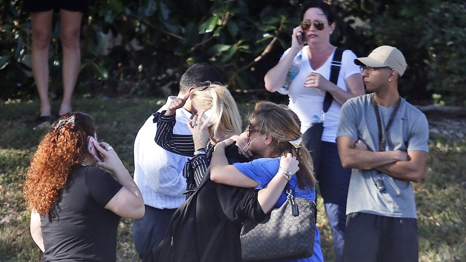 Anxious family members wait for news of students caught in a school shooting.