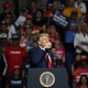 Donald Trump drinking from a glass of water at his Tulsa rally