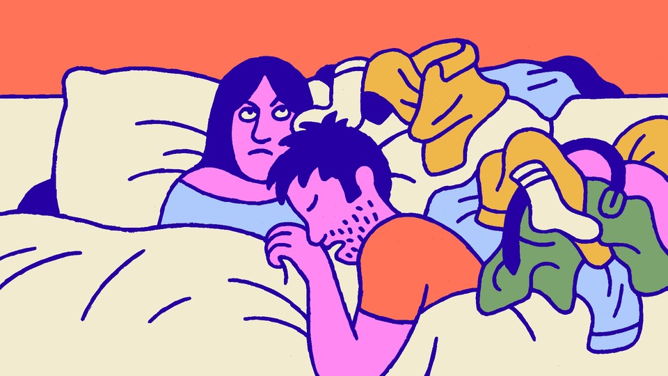 A wife awake in bed with her sleeping, unshaven husband, a messy pile of clothes by his side