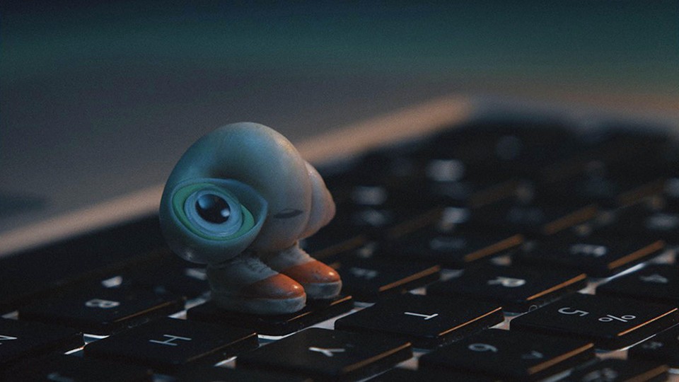 Marcel the shell stands on laptop keys