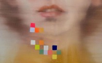 a painting of woman's mouth blurred with falling colored squares