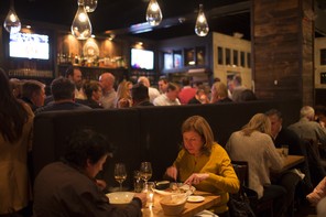 A couple sits at a table in a restaurant