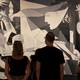 People looking at Guernica