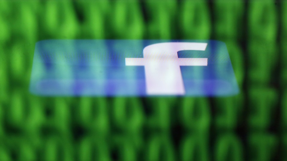 The Facebook logo superimposed over binary code