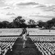 People visit the 'In America: Remember' public art installation near the Washington Monument in September 2021. The installation commemorates all the Americans who have died from COVID-19. It includes more than 650,000 small plastic flags.