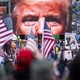 An image of President Donald Trump appears on video screens before his speech to supporters from the Ellipse at the White House in Washington on Wednesday, Jan. 6, 2021