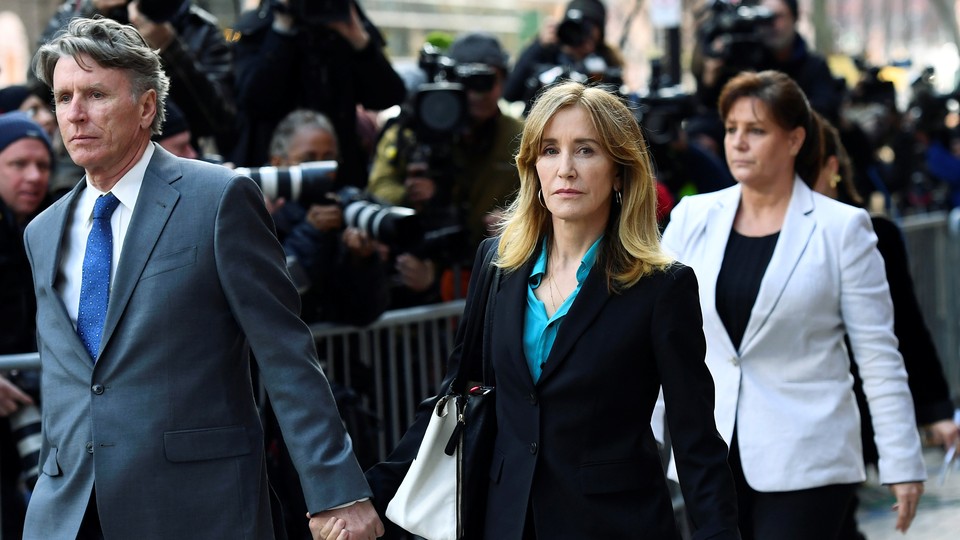 Felicity Huffman leaves a federal courthouse on April 3, 2019.