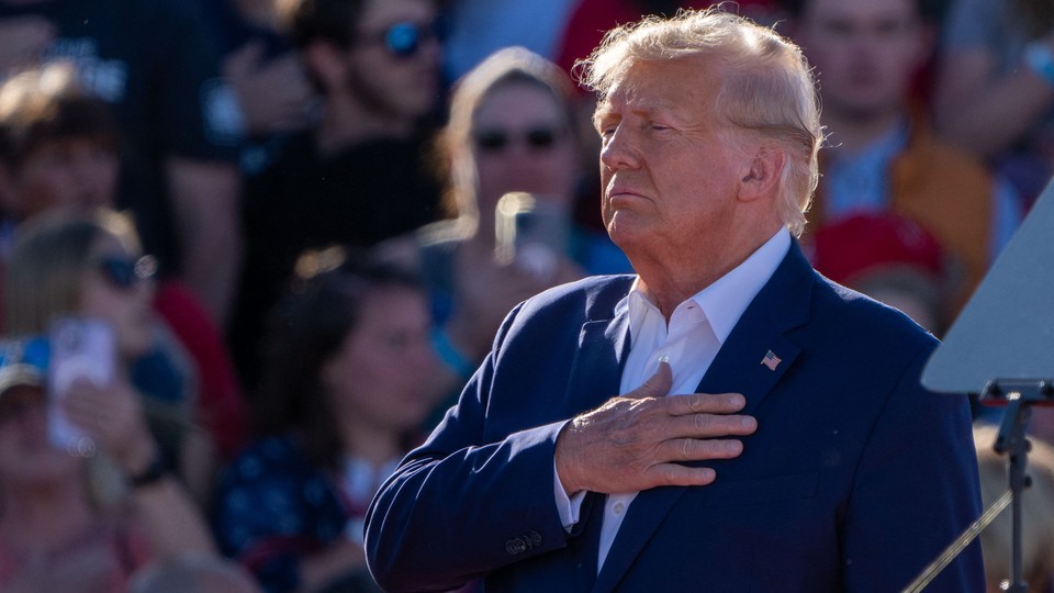 Donald Trump holds his hand over his heart during a 2024 campaign rally in Waco, Texas, on March 25, 2023.