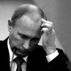 Vladimir Putin scratches his head.