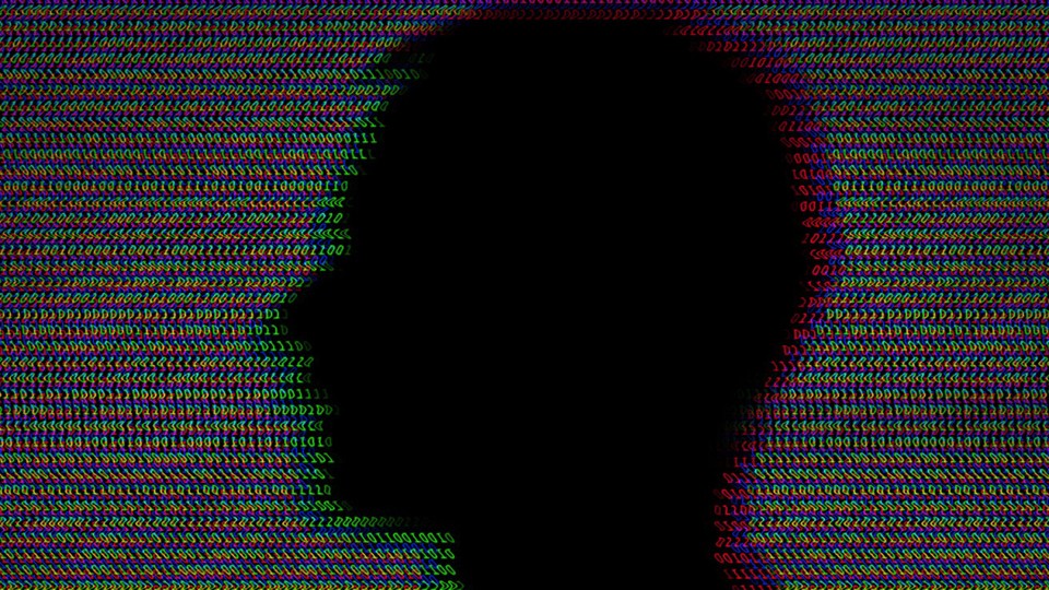 A man's silhouette in front of a background made up of repeating zeroes and ones