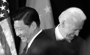 Joe Biden and Xi Jinping pass each other.