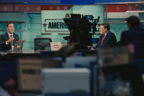 Mark Ravenhead (played by Zack Robidas) and Ben Stove (played by Tom Nichols) as talking heads on the set of a news show