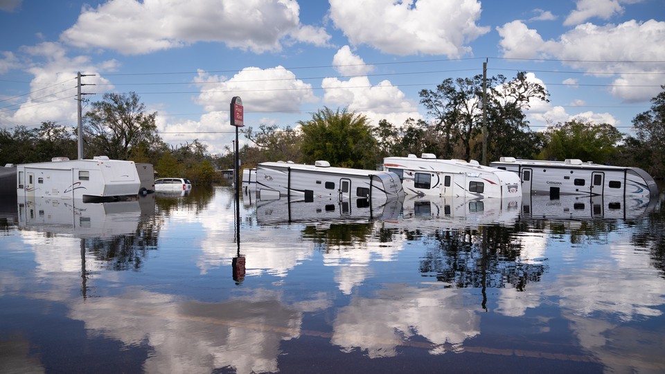 Travel trailers are inundated by floodwaters at the Peace River Campground on October 4, 2022 in Arcadia, Florida.