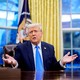 Donald Trump speaks during an executive order signing in the Oval Office