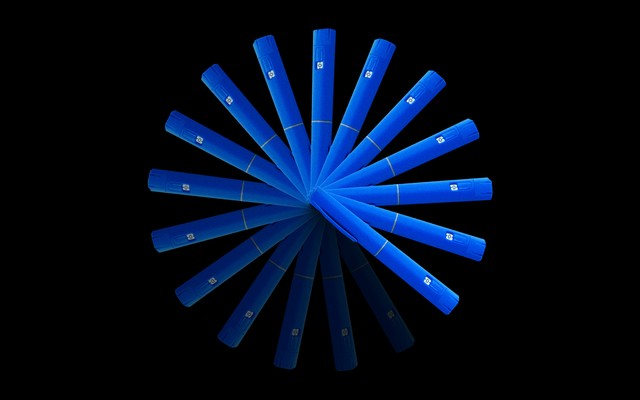 An illustration of GLP-1 drug-injection pens arranged in a circle and fading to black