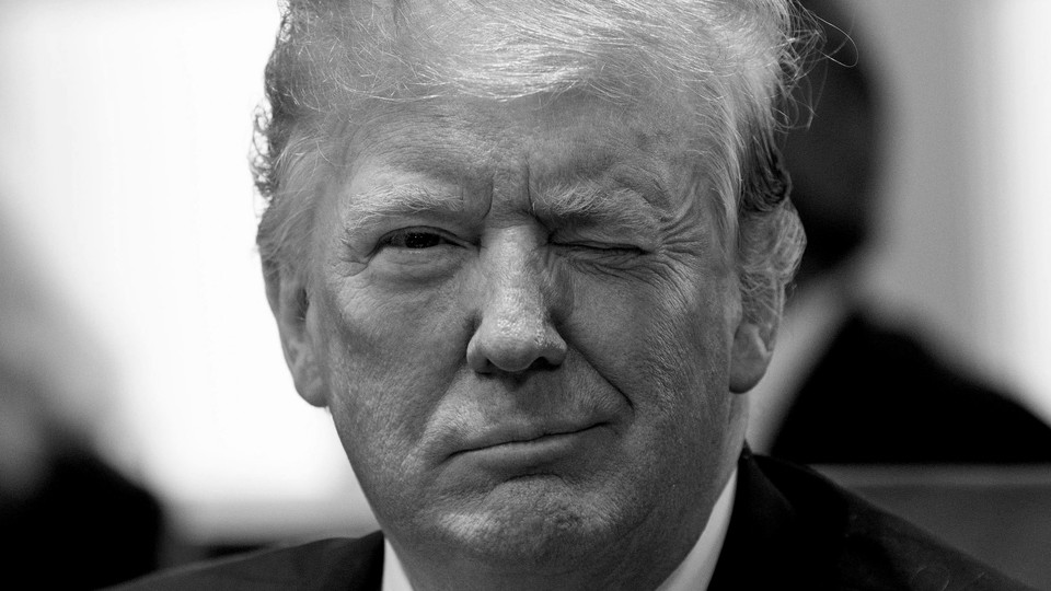 President Donald Trump winks at the camera.