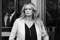 Black-and-white photo of Stormy Daniels leaving a court room