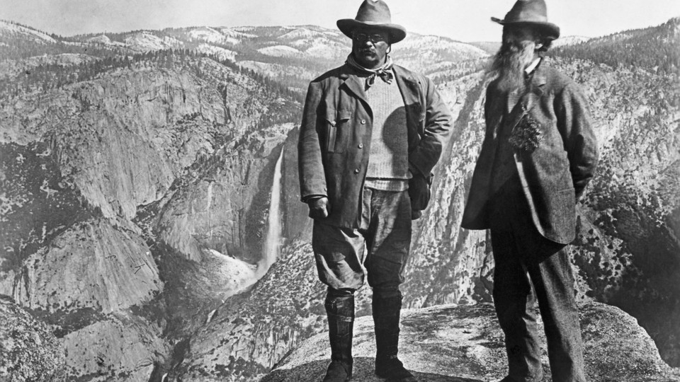 Theodore Roosevelt stands with John Muir on Glacier Point in Yosemite.