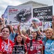 Anti-abortion protesters surrounded by bubbles in front of the Supreme Court