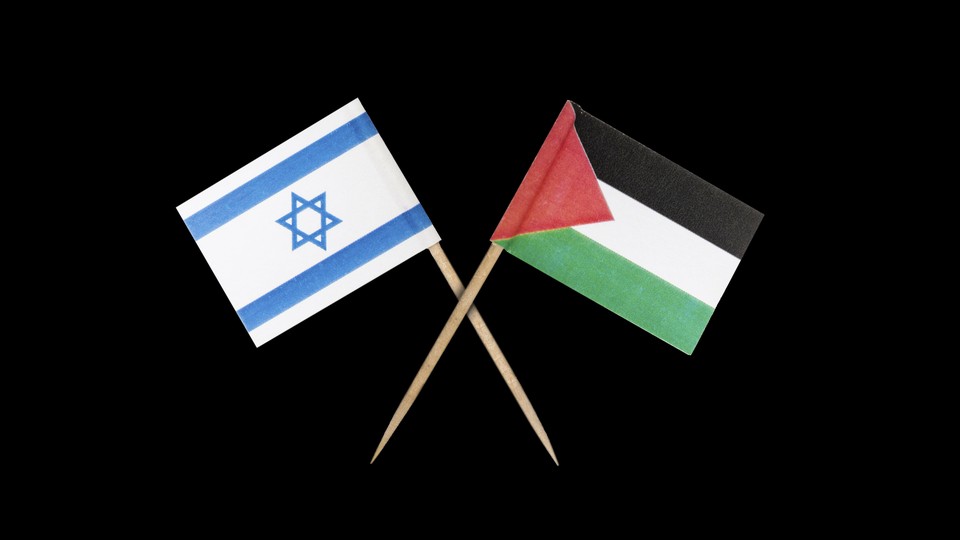 The Israeli and Palestinian flags, overlapping