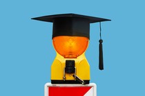 A warning light with a graduation cap on top