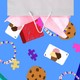 Image of a goody bag with objects falling out.