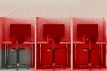 An image of office desks with a red hue