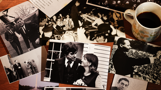 A photograph of multiple old pictures and documents with a brown cardboard box and cup of coffee.