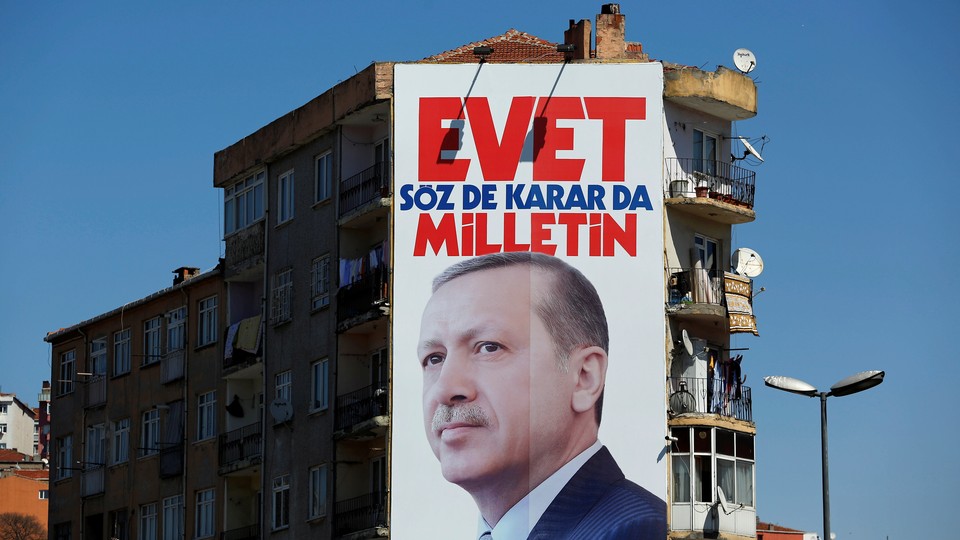 A billboard carrying a picture of Turkish President Tayyip Erdogan and a slogan that reads: "Yes. It is for the people to speak and to decide" in Istanbul