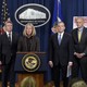 The Justice Department announced charges against four defendants, including two officers of Russian security services, for a mega data breach at Yahoo.