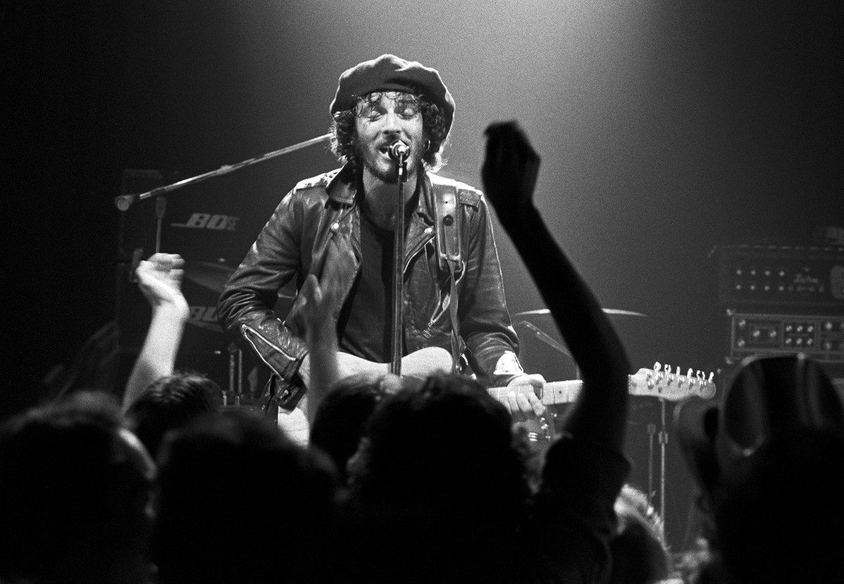 Bruce Springsteen sings and plays guitar onstage in 1975.