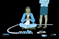 A woman crying surrounded by toys