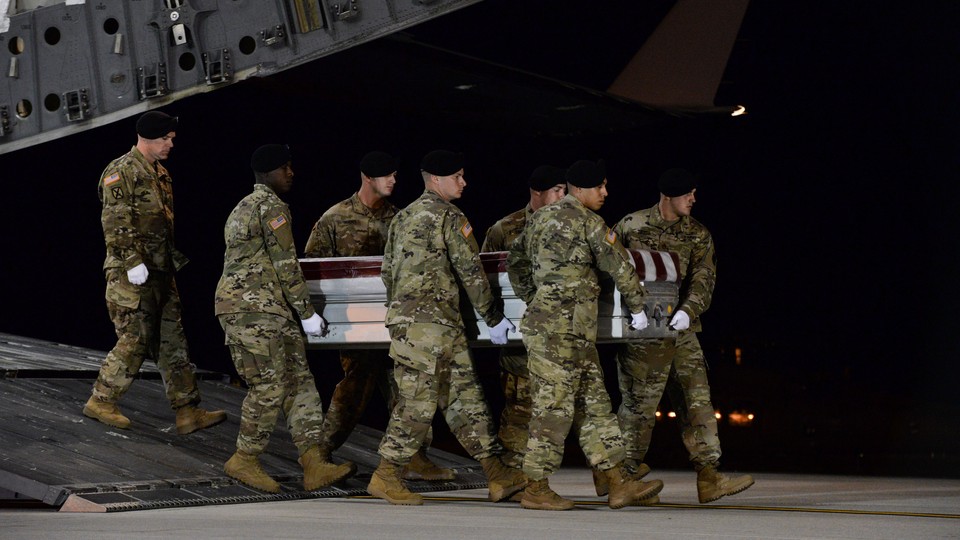 A U.S. Army carry team carried the coffin of Army Staff Sgt. Dustin Wright.